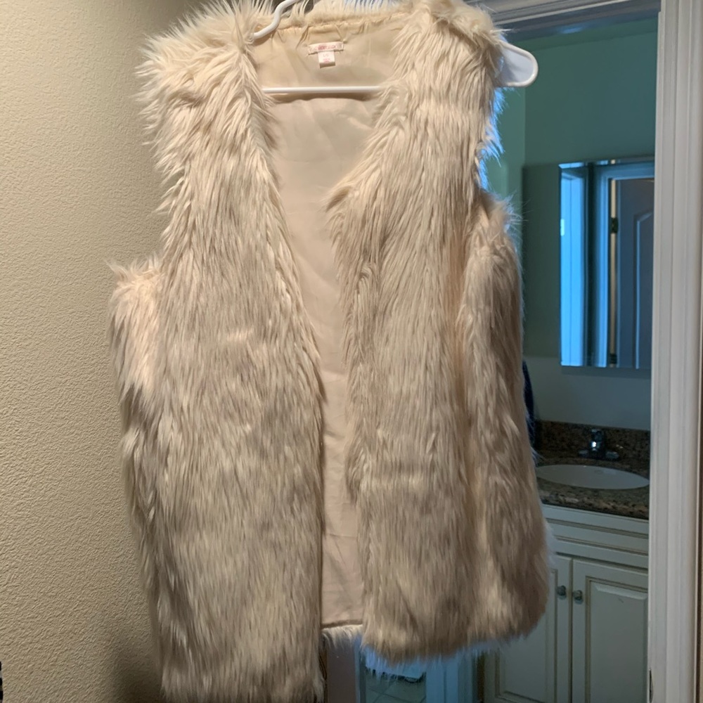 White fake fur vest